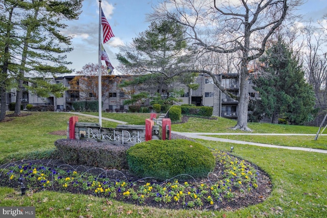 view of home's community with a yard