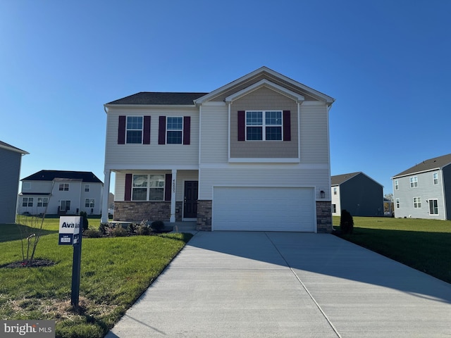 view of front of property with a garage and a front yard