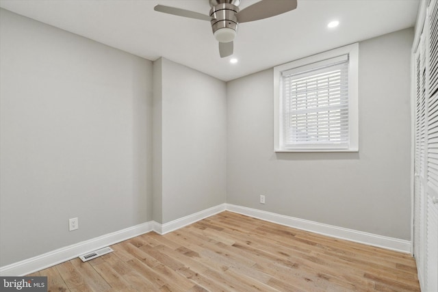 spare room featuring ceiling fan and light wood-type flooring