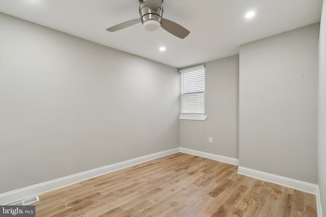 unfurnished room featuring ceiling fan and light wood-type flooring