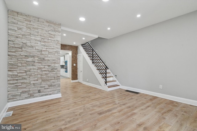 unfurnished living room with light hardwood / wood-style floors