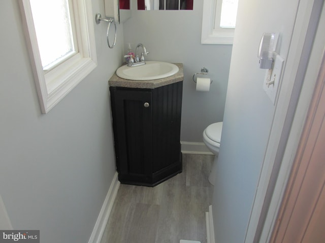 348 Broad St, Mount Holly, NJ 08060 - half bath featuring vanity, wood finished floors, and toilet