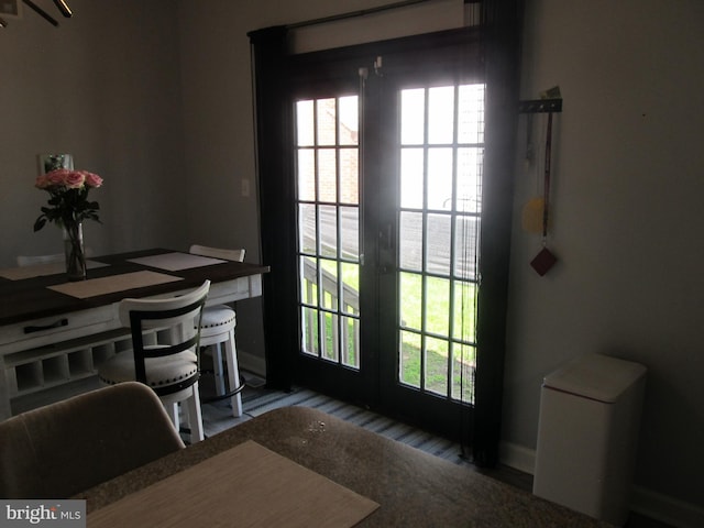 348 Broad St, Mount Holly, NJ 08060 - doorway to outside featuring plenty of natural light, wood finished floors, and baseboards