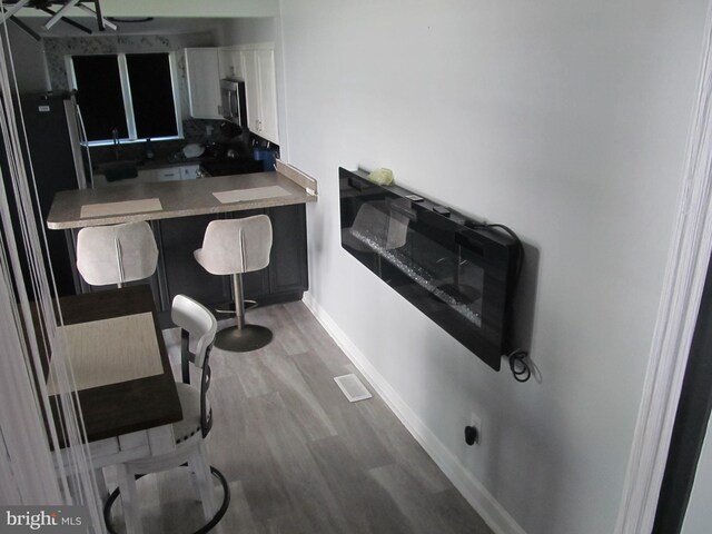 348 Broad St, Mount Holly, NJ 08060 - office area with wood finished floors and baseboards