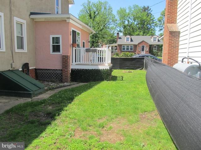 348 Broad St, Mount Holly, NJ 08060 - view of grassy yard with a wooden deck