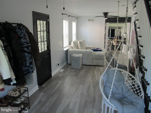 348 Broad St, Mount Holly, NJ 08060 - living area featuring a ceiling fan, wood finished floors, and baseboards