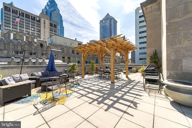 view of patio featuring outdoor lounge area, a view of city, and a pergola