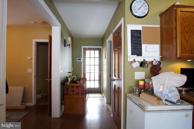 doorway featuring dark wood-type flooring