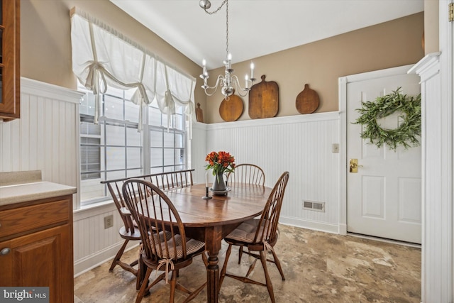 dining space featuring an inviting chandelier