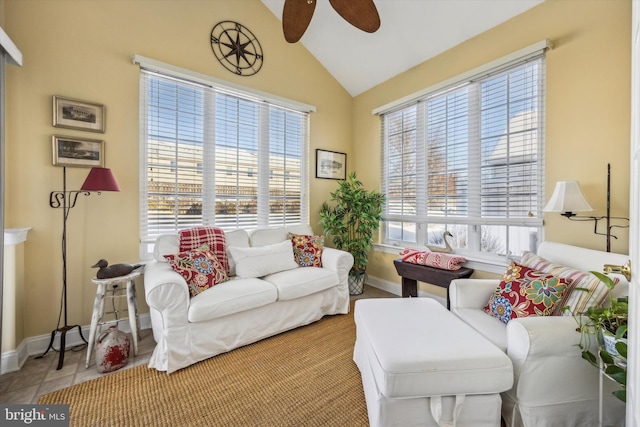 tiled living room with lofted ceiling and ceiling fan