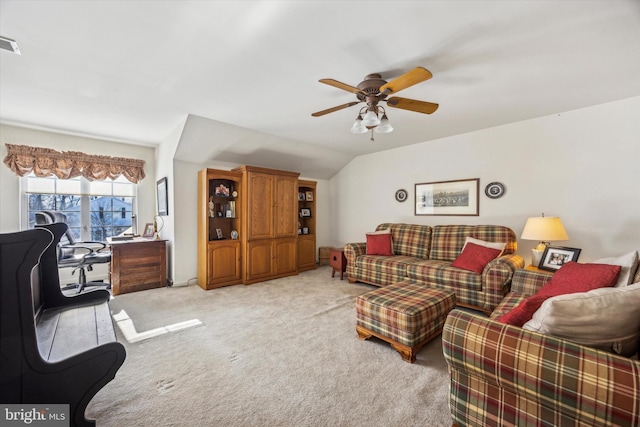 carpeted living room featuring lofted ceiling and ceiling fan