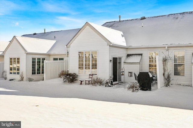 view of snow covered house