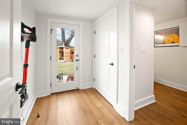 doorway with light hardwood / wood-style flooring