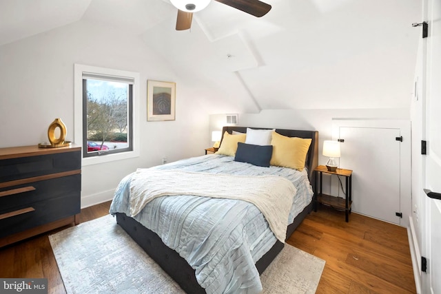 bedroom featuring lofted ceiling, hardwood / wood-style floors, and ceiling fan