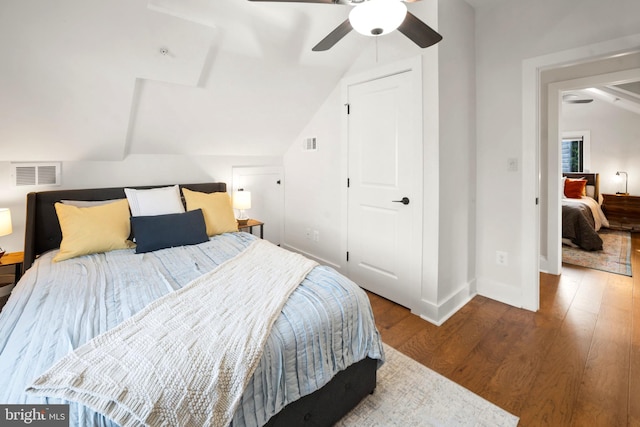 bedroom featuring hardwood / wood-style flooring, ceiling fan, and lofted ceiling