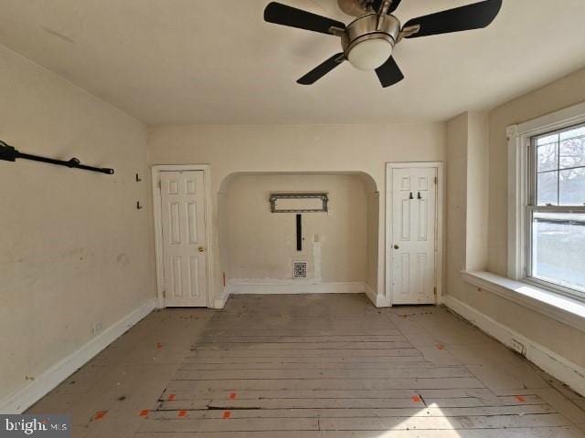 unfurnished room with ceiling fan