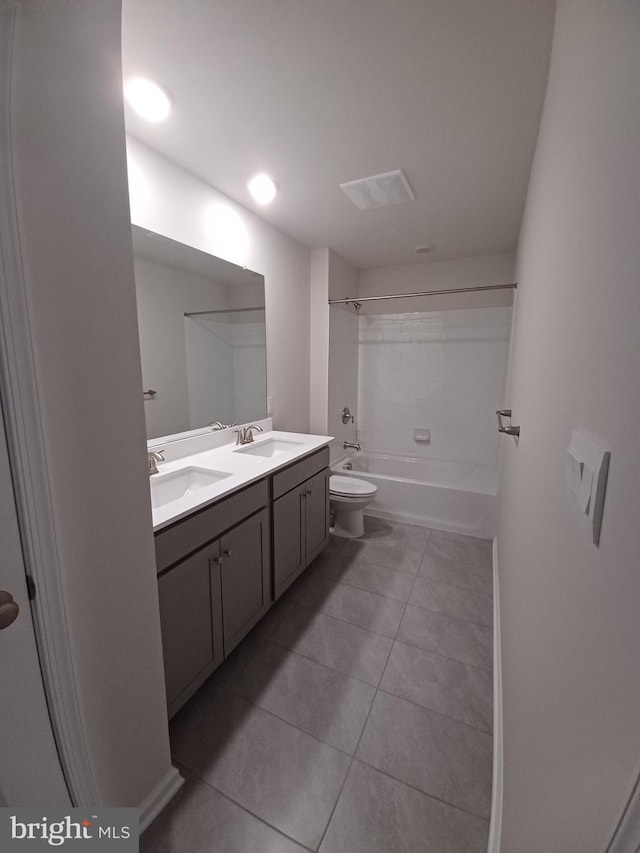 full bathroom featuring tile patterned flooring, vanity, tub / shower combination, and toilet