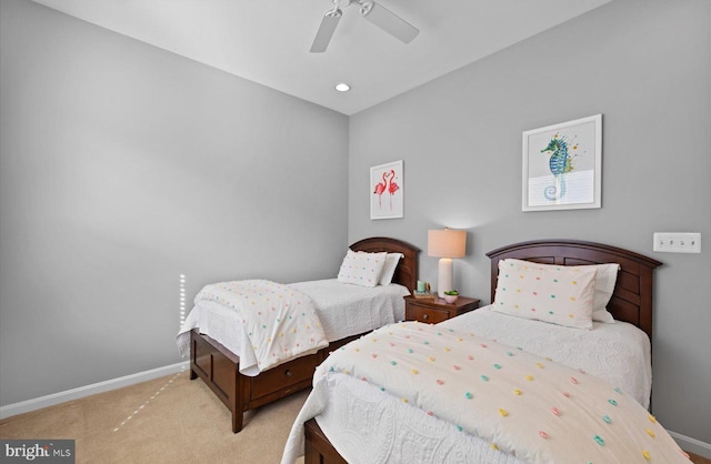 bedroom with light colored carpet and ceiling fan