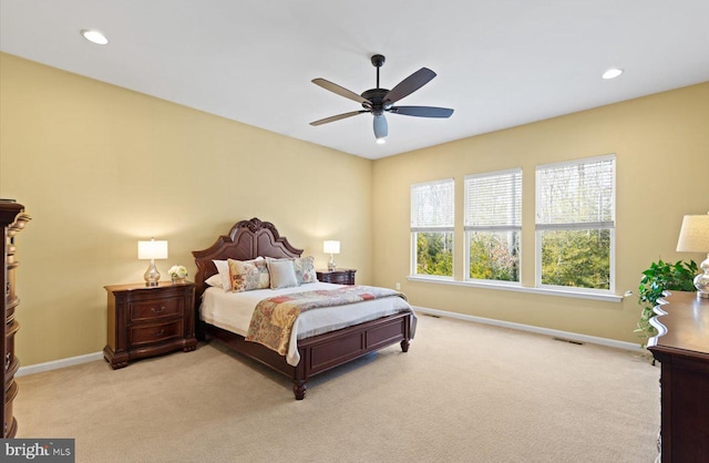 carpeted bedroom with ceiling fan