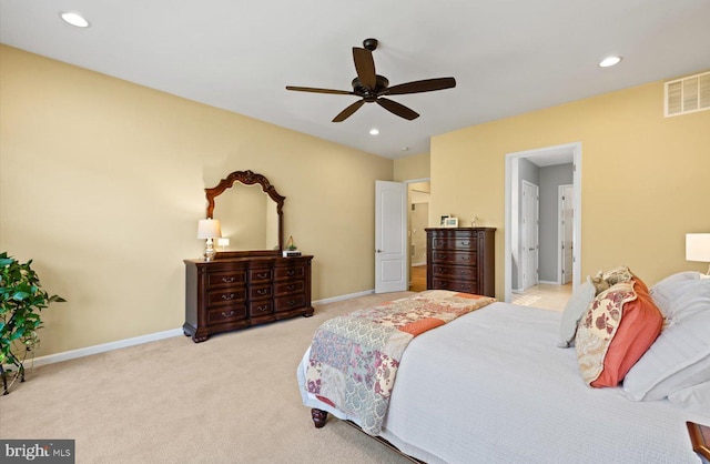 carpeted bedroom featuring connected bathroom and ceiling fan