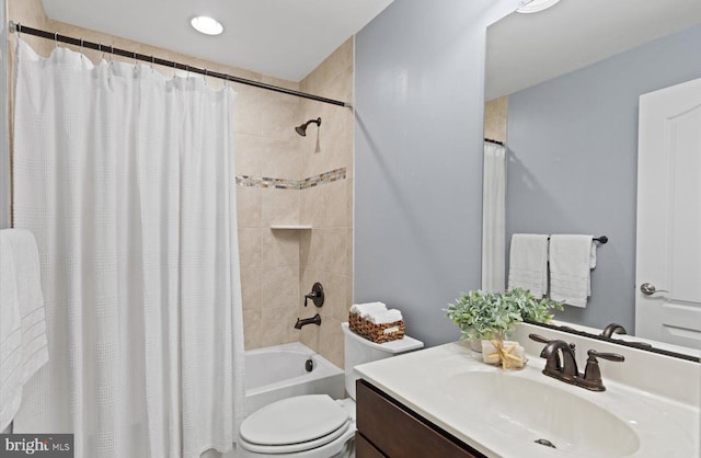 full bathroom featuring vanity, toilet, and shower / tub combo