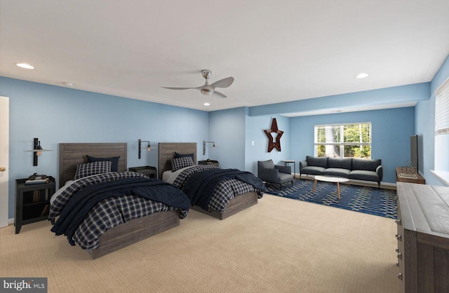 bedroom with light colored carpet and ceiling fan