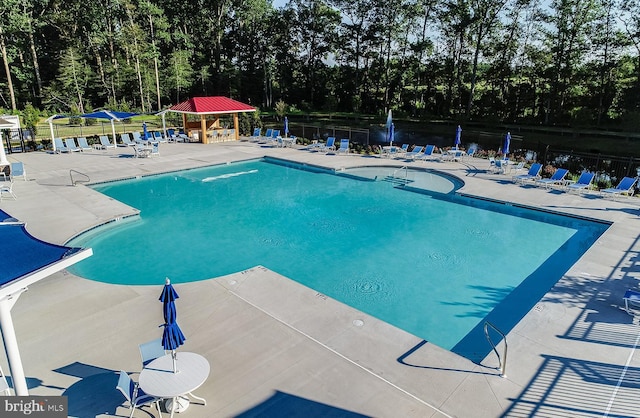 view of swimming pool featuring a gazebo and a patio