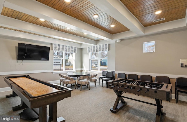 rec room featuring beamed ceiling, wood ceiling, carpet flooring, and plenty of natural light