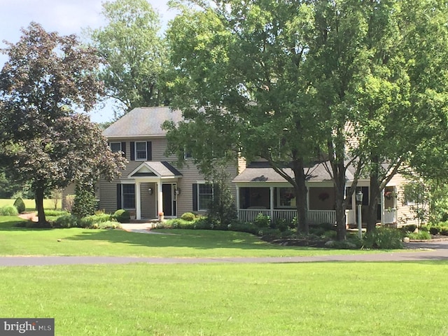 colonial house with a porch and a front lawn