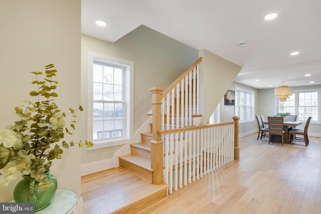 stairway featuring hardwood / wood-style floors