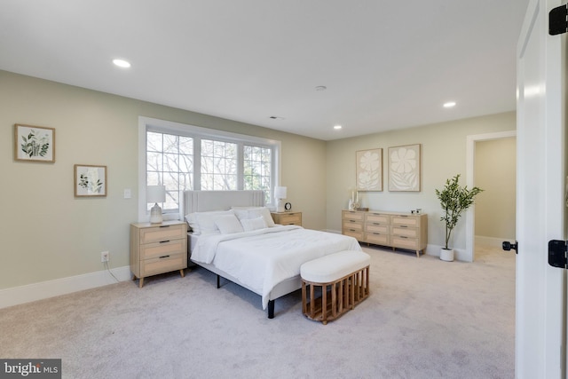 bedroom featuring light colored carpet