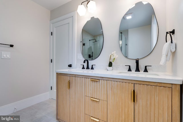 bathroom featuring an enclosed shower, vanity, and tile patterned floors