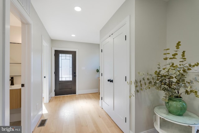 entrance foyer with light hardwood / wood-style floors