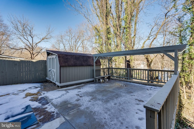 view of patio featuring a shed