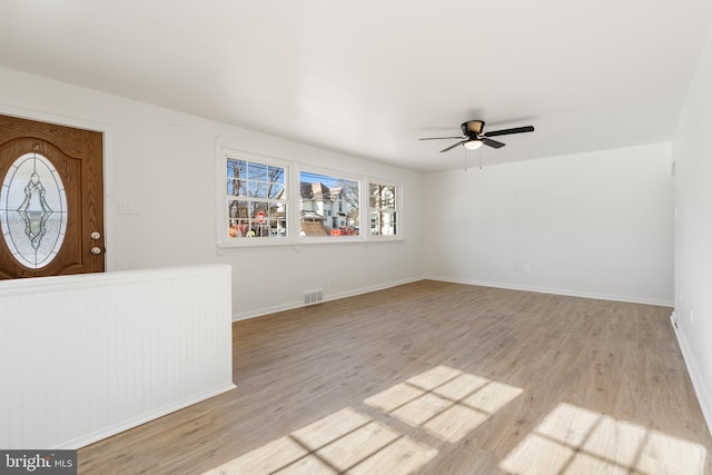 interior space with ceiling fan and light hardwood / wood-style floors