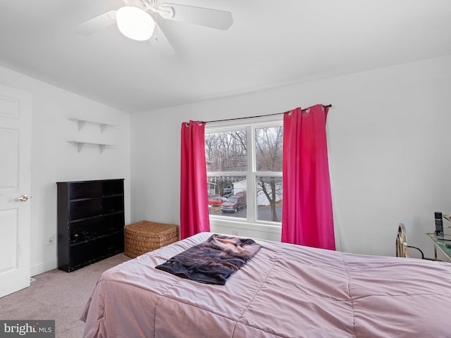 bedroom featuring lofted ceiling, light carpet, and ceiling fan