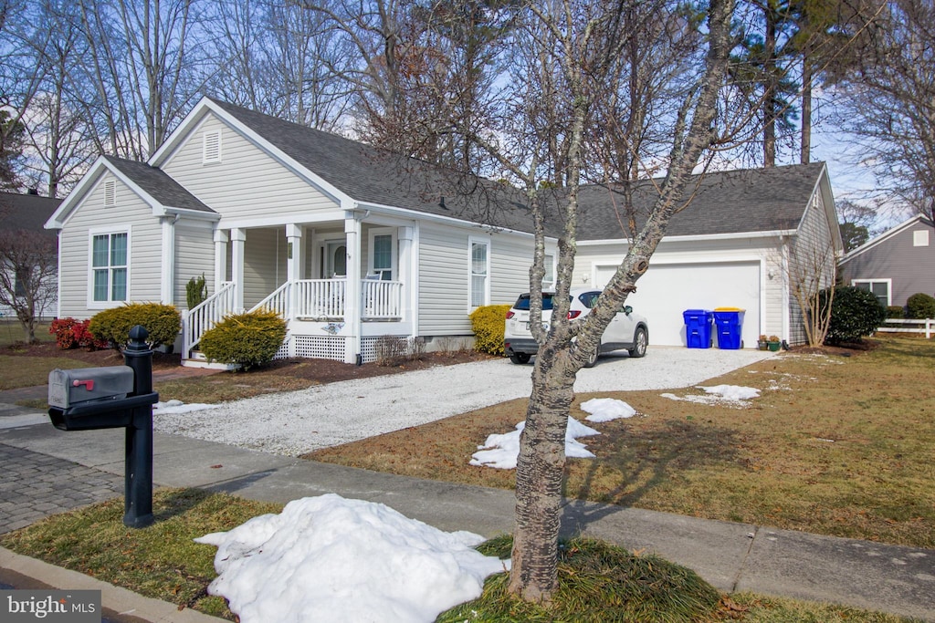 view of front of home with a garage and a porch