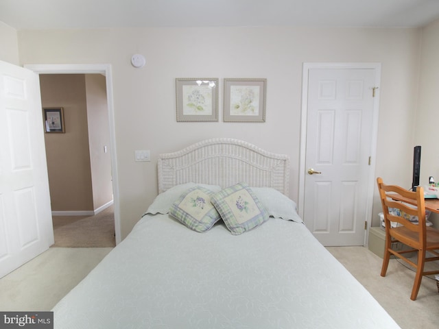 bedroom with light colored carpet