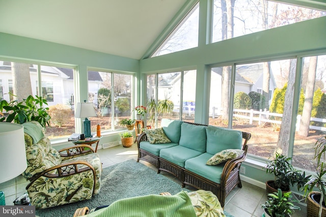 sunroom featuring lofted ceiling