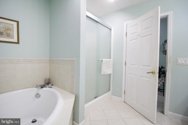 bathroom with tile patterned flooring and plus walk in shower