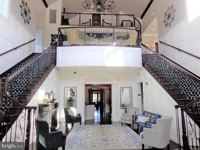 interior space with a notable chandelier and a high ceiling