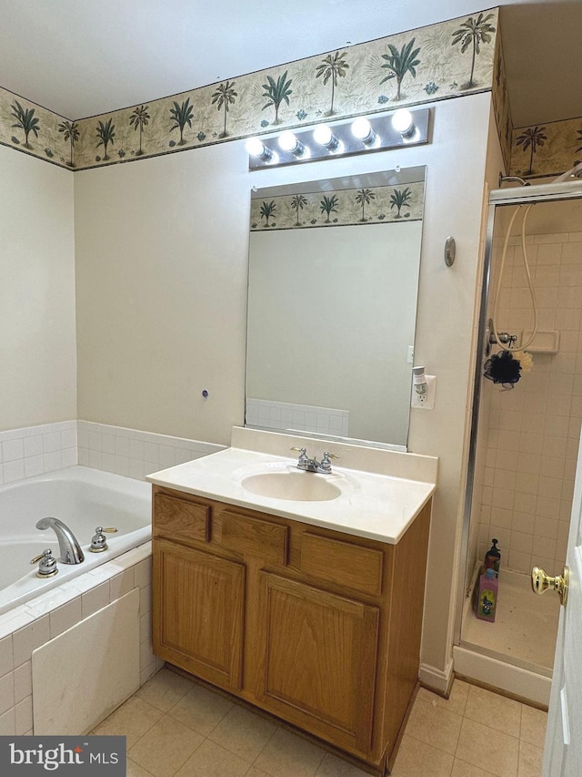 bathroom featuring vanity, tile patterned flooring, and separate shower and tub