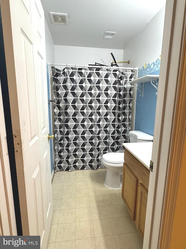 bathroom with vanity, a shower with curtain, tile patterned floors, and toilet