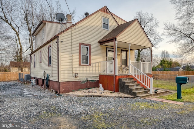 view of front of property with central AC and a porch