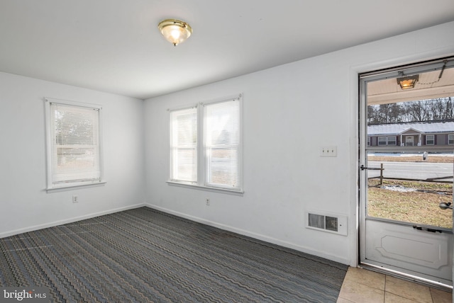 view of tiled spare room