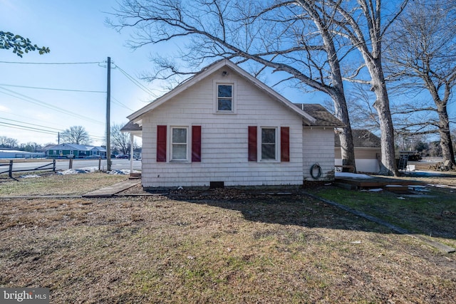 view of property exterior with a yard