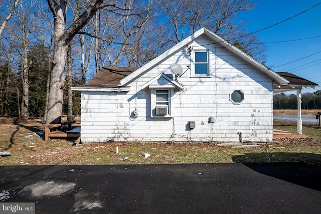 view of side of property with cooling unit