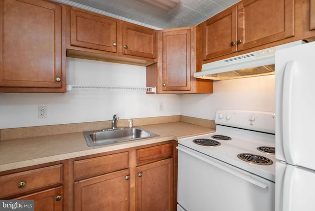 kitchen with sink and white appliances