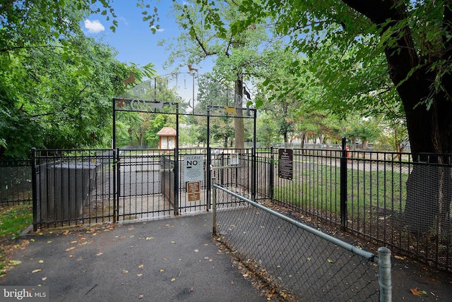 view of gate with fence