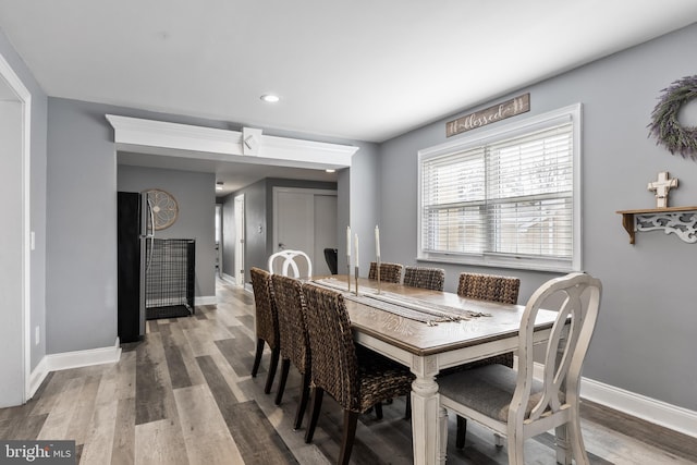 dining area with wood-type flooring